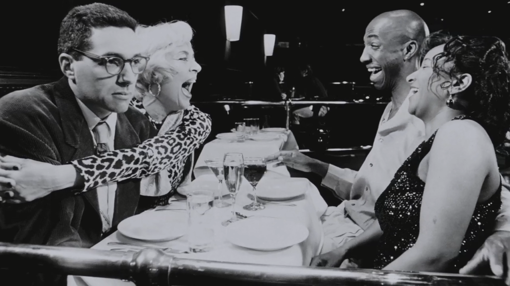 Left to right: Charles, Lola (Heather Morgan), Mel (J.B. Smoove), and Wanda (Wanda Sykes). This scene sums up the personality of the film quite well.