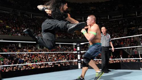 Roman Reigns Superman punches Superman stand-in John Cena.