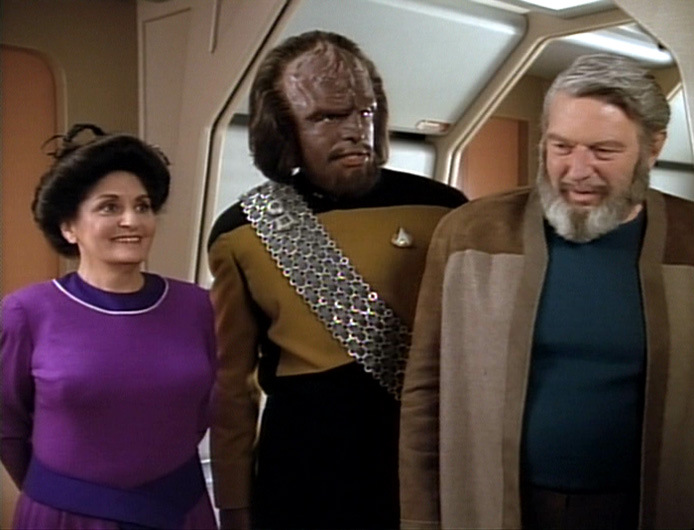 Worf with his adopted parents, the Rozhenkos.